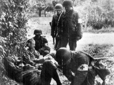 GI shot by German sniper near Cherbourg, 25 June 1944
