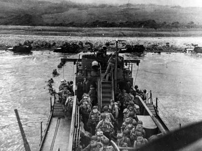 US Troops land from USS LCI(L)-412 during the D-Day assault on Omaha Beach, 6 June 1944
