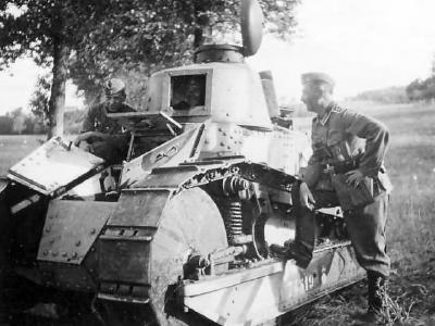 Two German soldiers posing with a light tank FT-17 74519, 1940