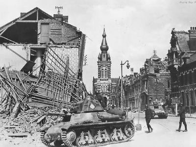 H39 tanks passing thru bombed town