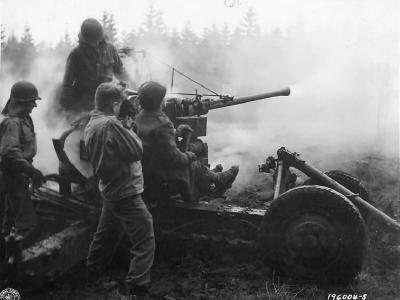 Soldiers of the 461st anti aircraft Battalion fire a 40mm Bofors gun at ground targets near Monschau Germany 1944