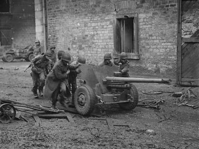 US 3rd Army Troops Roll 57mm Gun through the streets of Town on Saar Front 1944