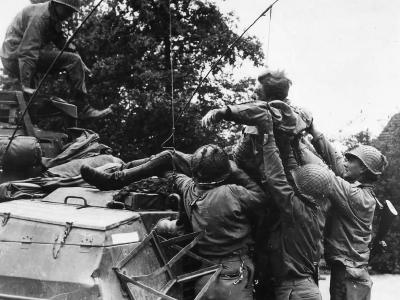 US Troops Aid Wounded German Soldier in Belgium 1944