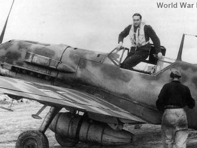 Pilot climbs out of cockpit of Bf109E