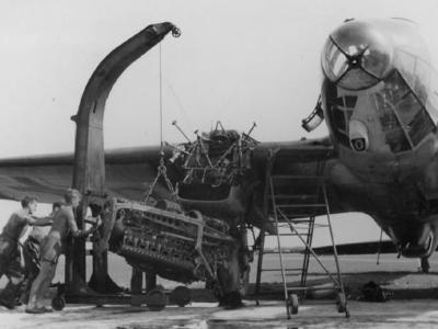 A heavy gantry crane is used in changing engine on a Heinkel He111
