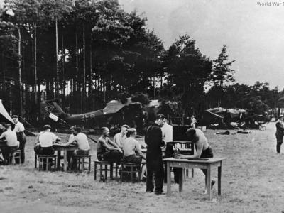 German pilots resting next to a Ju 87 dive bombers