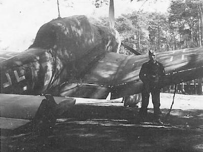 Ju87B parked near trees