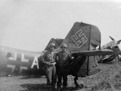 captured Junkers Ju 87 tail and US soldiers