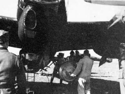 Ju88 bomber – groundcrew load up a bomb on the underwing racks