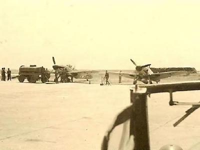 Me109 fighter planes being refueled on airfield