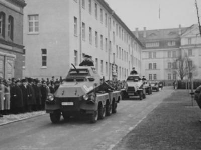 SdKfz 231 cars move along a street