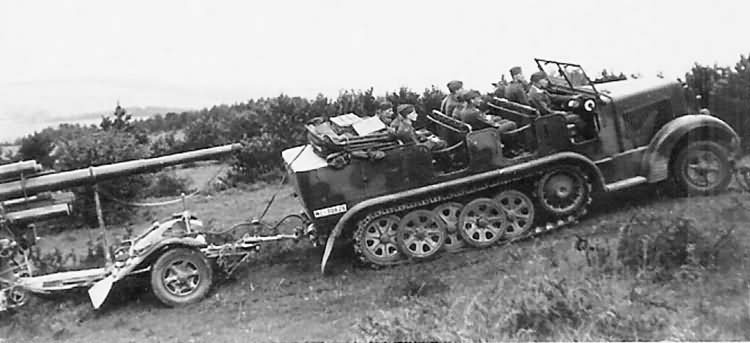 German medium halftrack Sdkfz 7 towing Flak 88 | World War Photos