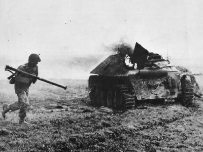 29th Infantry Division (United States) soldier by knocked-out Hetzer 1944