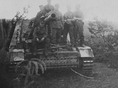 Crew atop a Hummel howitzer