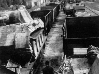 Panther Ausf D is loaded onto a flatbed railway car