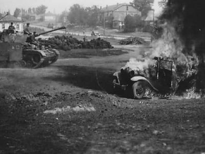 Panzerkampfwagen IV and burning truck