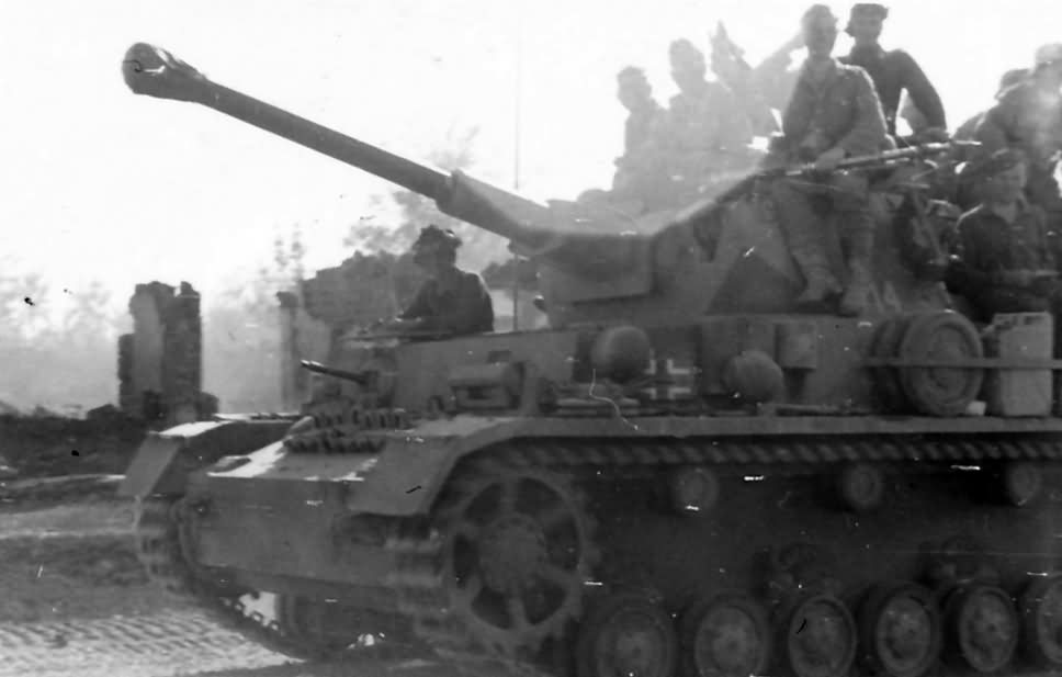 German infantry and tankers ride a Panzer IV | World War Photos