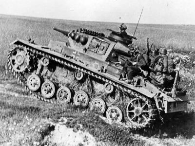 German infantry ride on a Panzer III