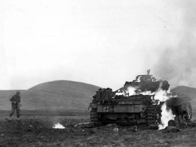 US soldier approaches burning Panzer III at Madjez El Bab 12 January 1943