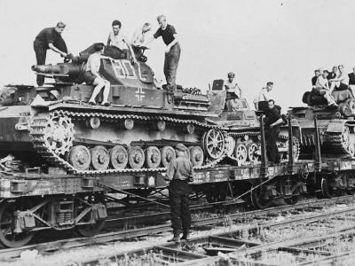 Panzer IV code 802 loaded onto a flatbed railway car