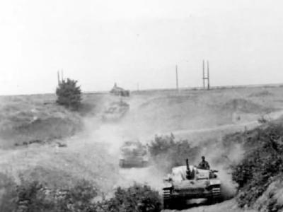 StuG 40 advancing along a dusty road towards the front lines