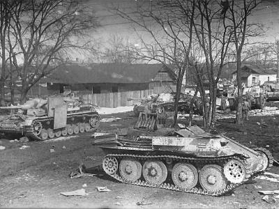 Sturmgeschutz IV and III. Wreckage of a Flakpanzer 38(t) in the foreground