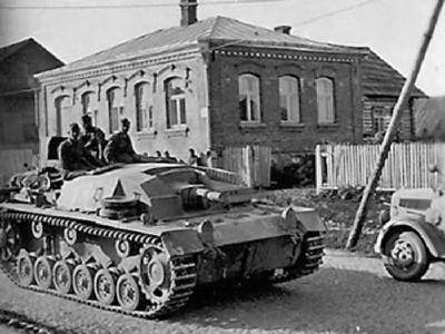 StuG III Ausf B Passing on Street Russia