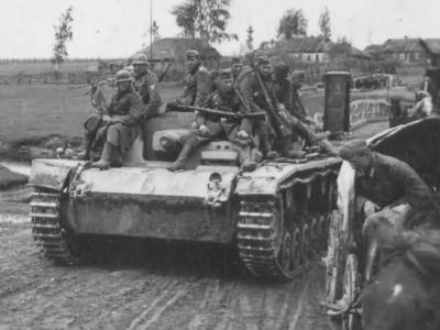 StuG III with German troops