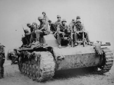 German troops sit on StuG III