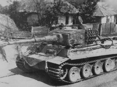 Tiger number 932 of the 9/3rd SS Panzergrenadier Division Totenkopf with camo net