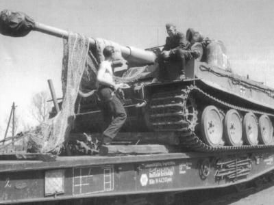 Tiger of the Schwere Panzer Abteilung 503, tank code II. Tank being transported on rail car.