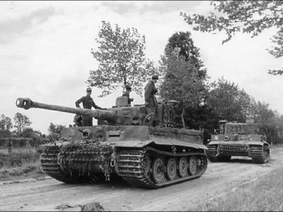 Tiger 232 of the Schwere SS-Panzer Abteilung 101 towing Tiger 231