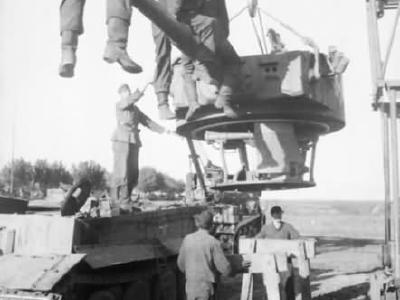 Crew of of the 3/schwere Panzerabteilung 503 removes the turret from Tiger tank #322