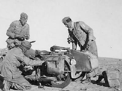 Luftwaffe afrika korps soldiers working on motorcycle