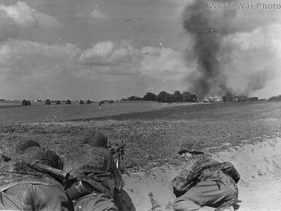 Waffen SS soldiers attacking a Russian village July 1941