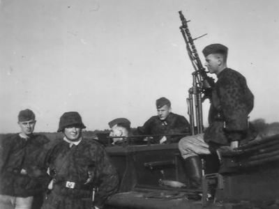 Soldiers of the Waffen-SS with halftrack Holland