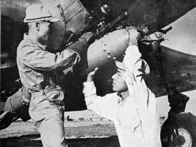 Loading a 60 kg bomb on a B5N