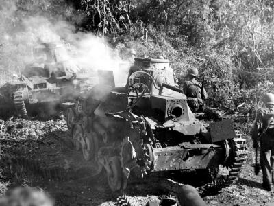 Type 95 Ha Go light tanks burning on Guam 1944