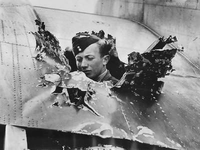 British Airman Views Damage to Hudson