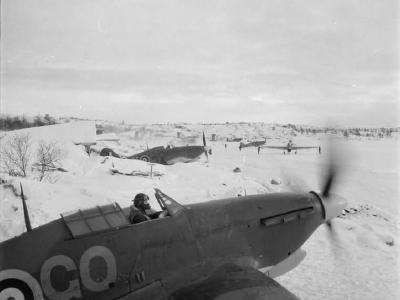 Hurricane Mk IIB of No 134 Squadron RAF scramble from their dispersals in the snow at Vaenga, Russia