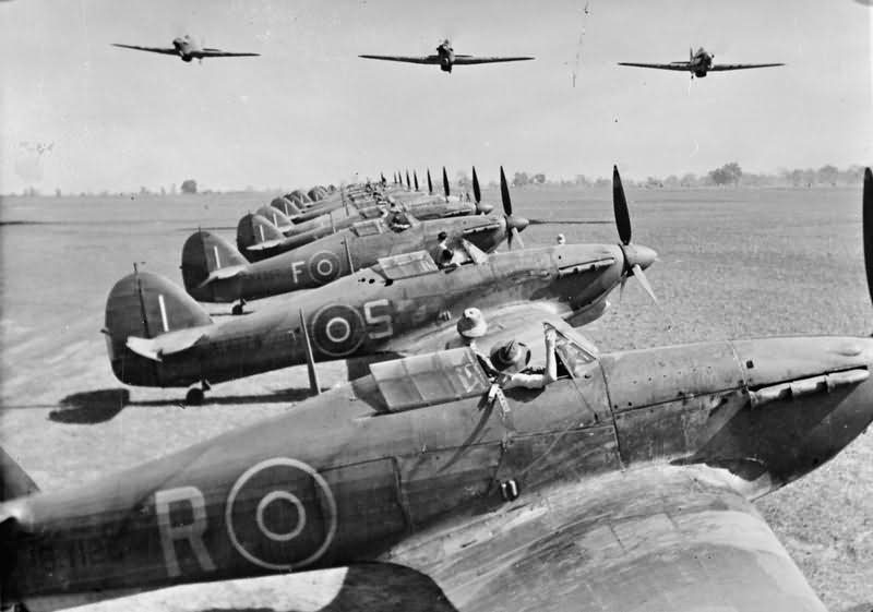 Hurricanes fly over the Hurricane Mk IIB and IIC of No 67 Squadron RAFat Chittagong India