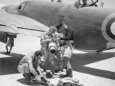 Crew of a Martin Maryland of No 39 Squadron RAF unship a Type F.24 aerial camera
