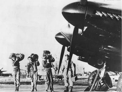 Crewmen load aerial cameras on to a Mosquito