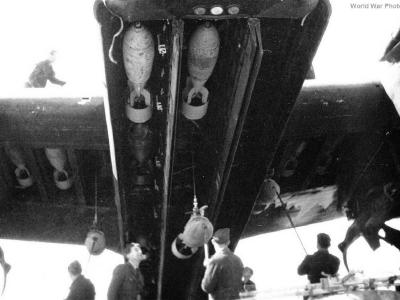 Ground crewman hoist bomb 1942