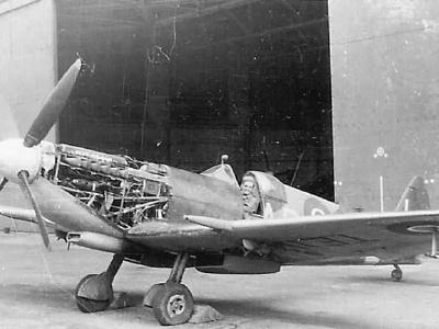 Supermarine Spitfire Fighter Parked by Hangar
