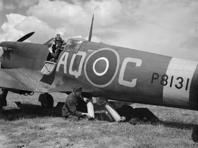 Ground crew loading a dinghy into a Spitfire Mk IIA, serial P8131 AQ-C of No. 276 Squadron RAF at Warmwell