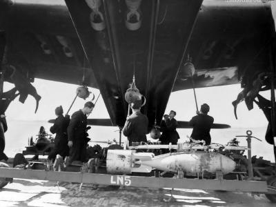 Stirling armourers loading bombs