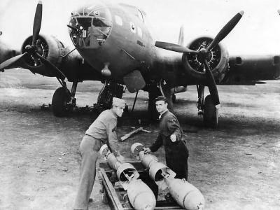 Ground crew loading bombs on Boeing B-17E in Australia