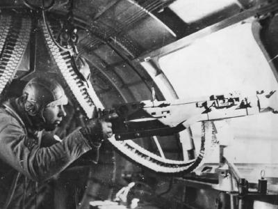 Waist gunner mans .50 caliber (12,7 mm) machine gun aboard B-17 Flying Fortress