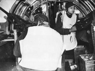 Waist gunners demonstrate flak jackets on B-17 Flying Fortress
